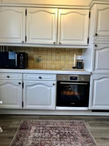 Kuchyňa alebo kuchynka v ubytovaní Apartment Bourg St Maurice