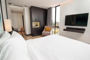 Katil atau katil-katil dalam bilik di GLOW PARK HOTEL Grand Royal Palace