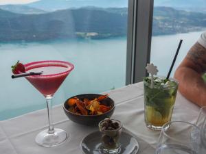 a table with a drink and a bowl of food on it at Studio Aix-les-Bains, 1 pièce, 2 personnes - FR-1-555-44 in Aix-les-Bains