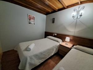 Ein Bett oder Betten in einem Zimmer der Unterkunft Pensión Riosol