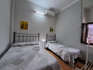 Ein Bett oder Betten in einem Zimmer der Unterkunft Pensión Riosol