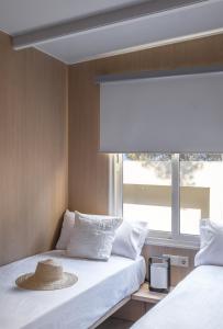 Posteľ alebo postele v izbe v ubytovaní wecamp Cala Montgó