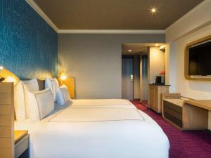 Ein Bett oder Betten in einem Zimmer der Unterkunft Swissotel Nankai Osaka