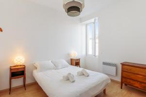 Ένα ή περισσότερα κρεβάτια σε δωμάτιο στο Appartement Citadelle - Welkeys