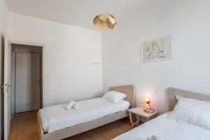 Un pat sau paturi într-o cameră la Appartement Citadelle - Welkeys