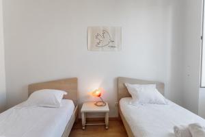 Ένα ή περισσότερα κρεβάτια σε δωμάτιο στο Appartement Citadelle - Welkeys
