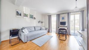 Televízia a/alebo spoločenská miestnosť v ubytovaní Villa Klif, Sun & Snow