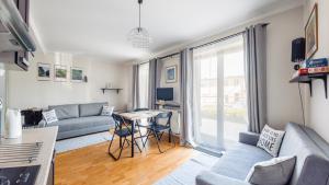 Televízia a/alebo spoločenská miestnosť v ubytovaní Villa Klif, Sun & Snow