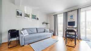 Televízia a/alebo spoločenská miestnosť v ubytovaní Villa Klif, Sun & Snow