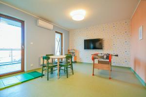 Zdjęcie z galerii obiektu Słońce & Plaża Apartamenty Krynica Morska w Nautikka Park w mieście Krynica Morska