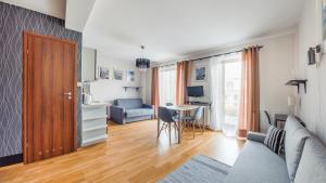 Televízia a/alebo spoločenská miestnosť v ubytovaní Villa Klif, Sun & Snow