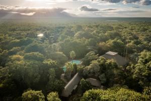 an aerial view of a house in the middle of a forest at Sunbirds Oasis Lodge in Hoedspruit