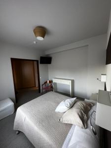 A bed or beds in a room at San Luis