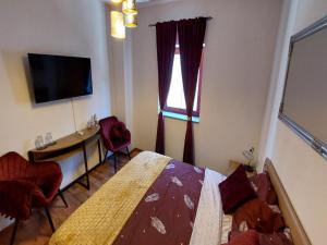 TV a/nebo společenská místnost v ubytování Rooms Argo