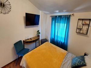 TV a/nebo společenská místnost v ubytování Rooms Argo
