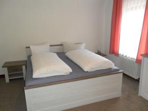 Katil atau katil-katil dalam bilik di Hotel Hirsch