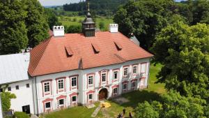 an aerial view of a large building with a red roof at HolidayPark Mlázovy in Kolinec