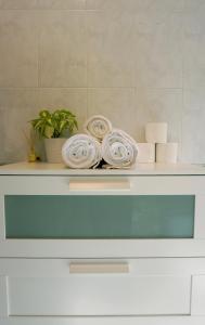 a shelf with a plant and plates on it at Fuerteventura Beach Vacations in Puerto del Rosario