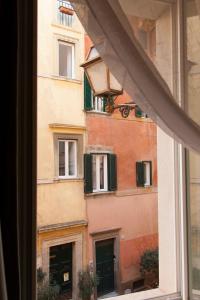 a view of a building from a window at Palazzetto de Lante Appartamento Pinta in Rome