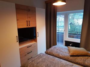 A bed or beds in a room at Exklusiv Apartment Sonnenalp