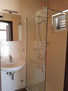 a bathroom with a shower and a sink at Holiday home in Milna with terrace, air conditioning, WiFi, washing machine 5123-1 in Milna