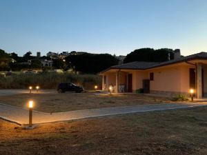a car parked in front of a house at night at Villa dei Pini Capoliveri in Capoliveri