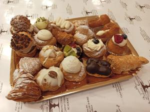 a tray filled with different types of pastries at Piccoli Desideri Tra le Singolarità del Molise in Forlì del Sannio