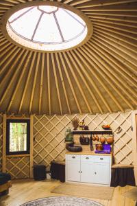 een keuken in een yurt met een groot raam bij Lapiland - off-grid yurts & tipis - the place to reconnect with nature 