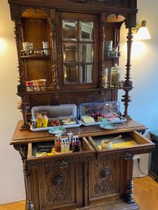 a wooden buffet with food on top of it at Gästehaus Villa Kreativ Susanne Lay in Bad Münder am Deister