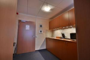 Kuchyň nebo kuchyňský kout v ubytování Hotel Nord