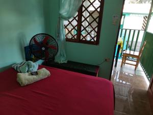 Кровать или кровати в номере Cabinas Mitchaelle's