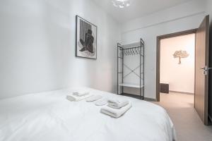 Ένα ή περισσότερα κρεβάτια σε δωμάτιο στο Iguana Gold Luxury Suites 2 ( 1 min from Ermou street)