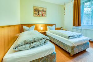 Postel nebo postele na pokoji v ubytování Guesthouse Beckmann