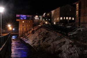 a city at night with snow on the ground at Oberstdorf Hostel in Oberstdorf