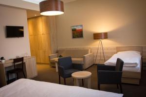 Postel nebo postele na pokoji v ubytování Hotel Freud