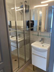 a bathroom with two sinks and a shower at STUDIO PIED DANS L EAU in La Londe-les-Maures