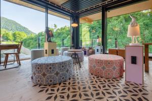 a room with two ottomans and two stools at Oberstdorf Hostel in Oberstdorf