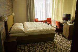 Postel nebo postele na pokoji v ubytování Hotel Freud