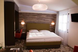Postel nebo postele na pokoji v ubytování Hotel Freud
