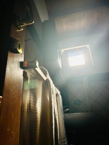 a room with a window and a curtain in a room at Podere La Branda in Vetralla