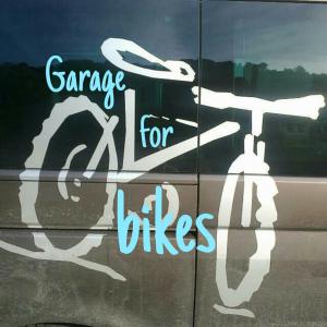 a sign on the side of a car that says dance for bikes at Casa Lisa in Finale Ligure