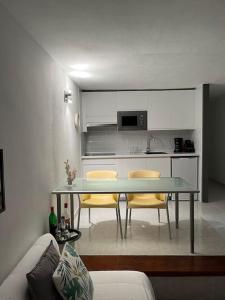 a kitchen with a table and chairs in a room at Apartment PM237 - Paraiso Maspalomas in Playa del Ingles