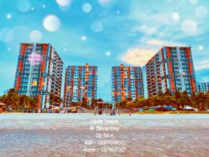 a picture of a beach with tall buildings at TimurBay Seafront Residence at Casa Inara in Kuantan