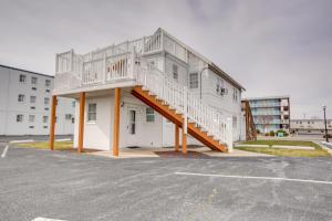 a white building with a staircase on the side of it at Empress Motel in Ocean City