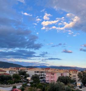a view of a city under a cloudy sky at Kamari Luxury Apartment in Lefkada Town