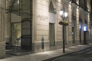 a building with a street light in front of it at Hospes Amérigo, Alicante, a Member of Design Hotels in Alicante
