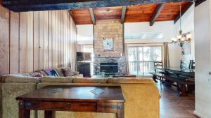 a living room with a couch and a table at Chamonix Condo 94 Condo in Mammoth Lakes