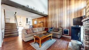 a living room with a couch and a table at Chamonix Condo 94 Condo in Mammoth Lakes +61 photos