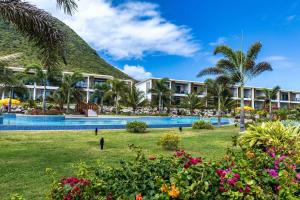 a view of the resort from the gardens at Golden Rock Dive and Nature Resort in Oranjestad