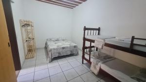Ένα ή περισσότερα κρεβάτια σε δωμάτιο στο Hospedagem do BIRÓ +24 φωτογραφίες